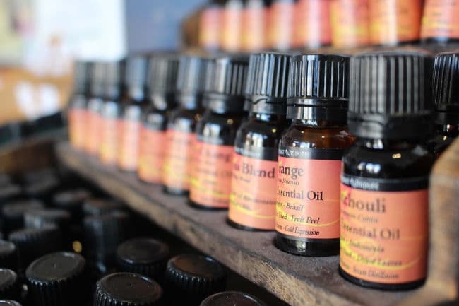 Bottles of essential oils on shelving